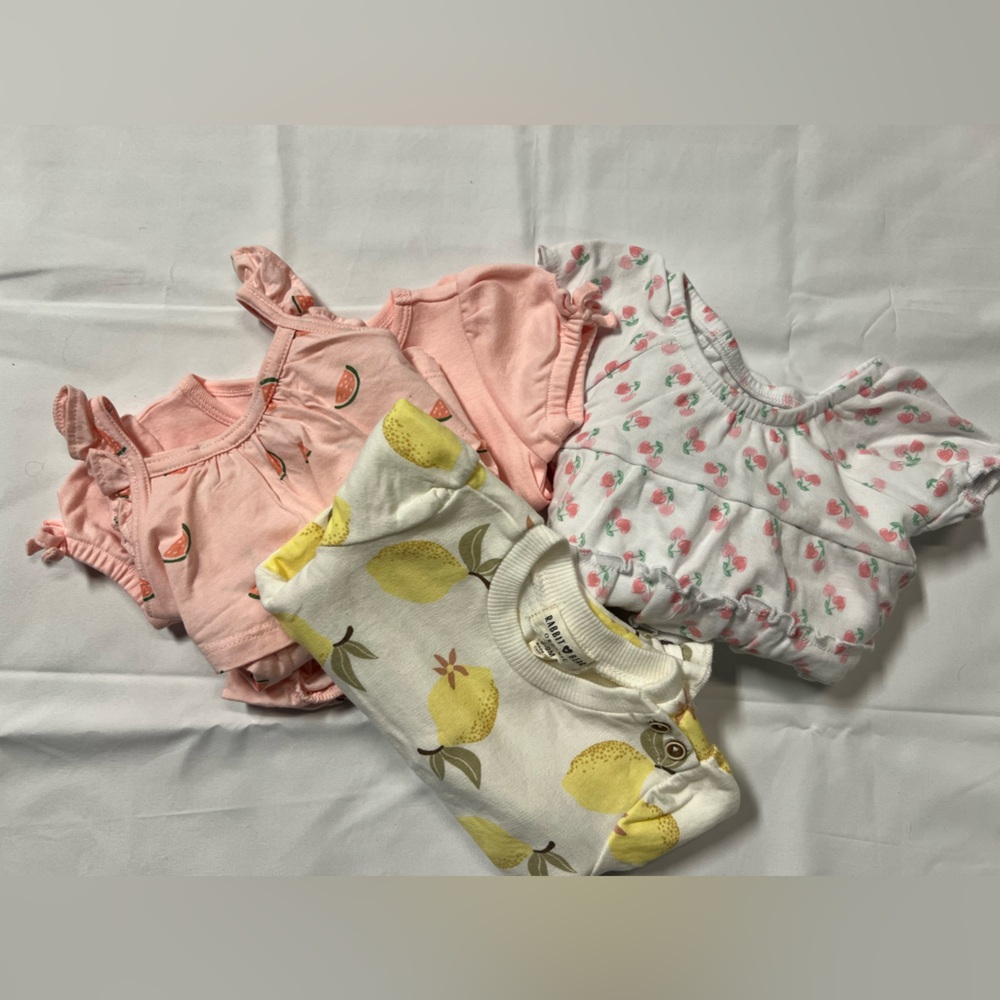 Bundle of infant girls outfits.